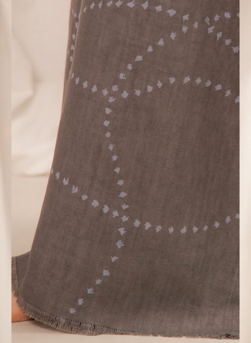 detail of length liara kaftan charcoal printed and hand-embroided